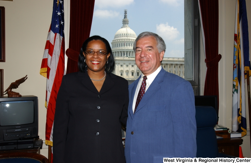 Congressman Rahall stands with a woman in his Washington office.