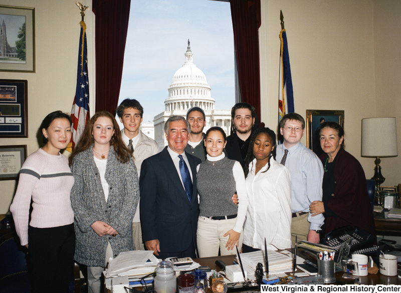 Congressman Rahall stands with nine others in his Washington office.