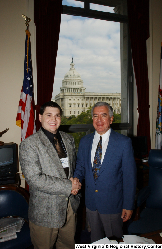 Congressman Rahall stands in his Washington office with a man whose last name on his NYLC badge is Rahall.