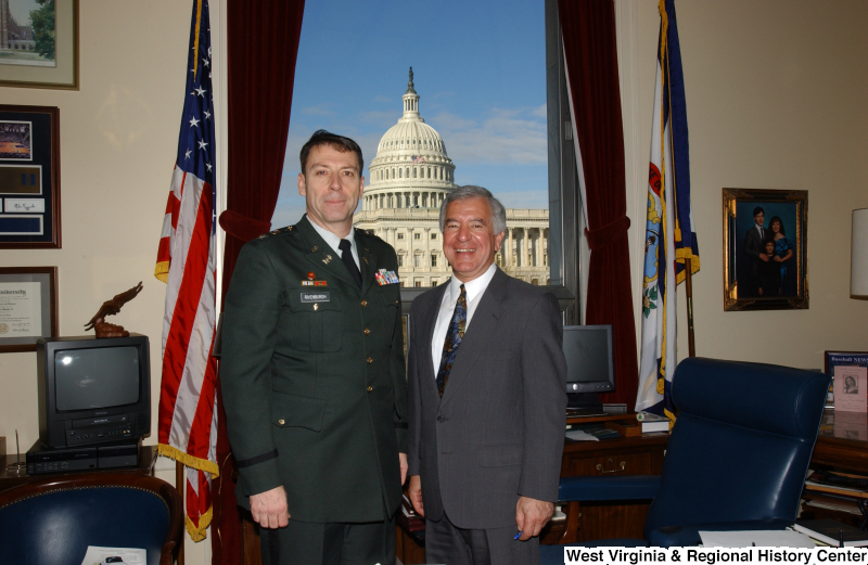 Congressman Rahall stands in his Washington office with Rivenburgh (military officer).