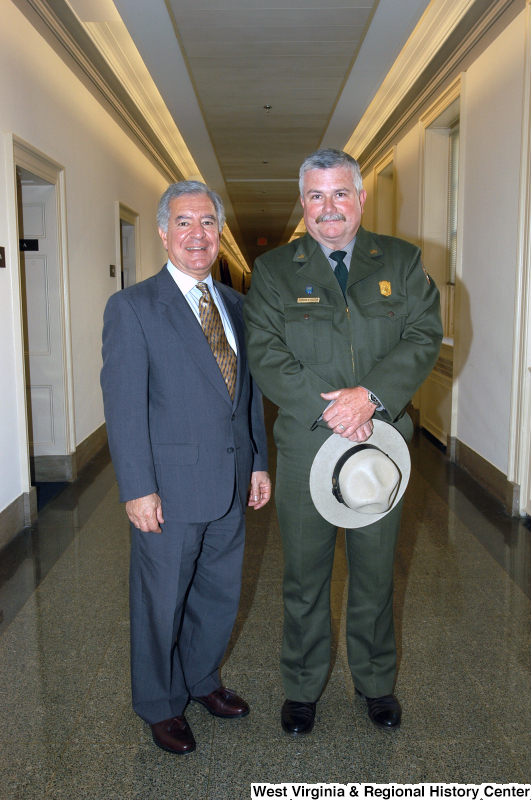 Photograph of Congressman Rahall standing in a hallway with a man from the Park Service