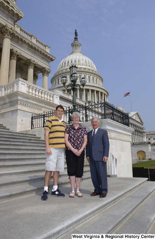 Congressman Rahall stands on the steps of the Capitol Building with a man and woman.