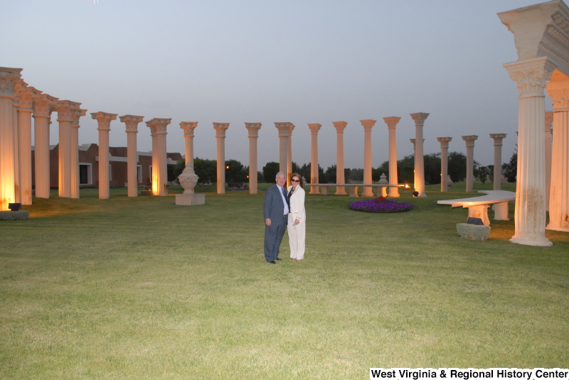 Congressman Rahall stands with a woman amid architectural columns during a Congressional Delegation trip to Saudi Arabia.