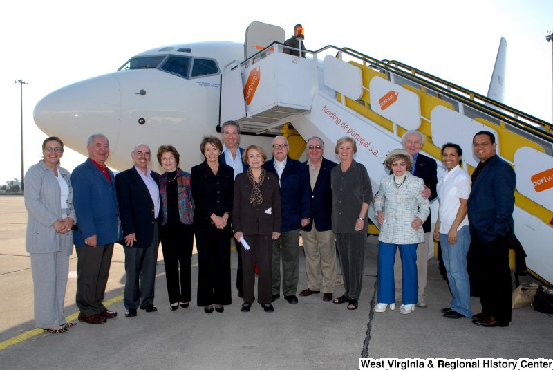 Congressman Rahall, Keith Ellison, Tom Lantos, Nancy Pelosi, Louise Slaughter, Henry Waxman, and others stand next to an airplane during a Congressional Delegation trip.