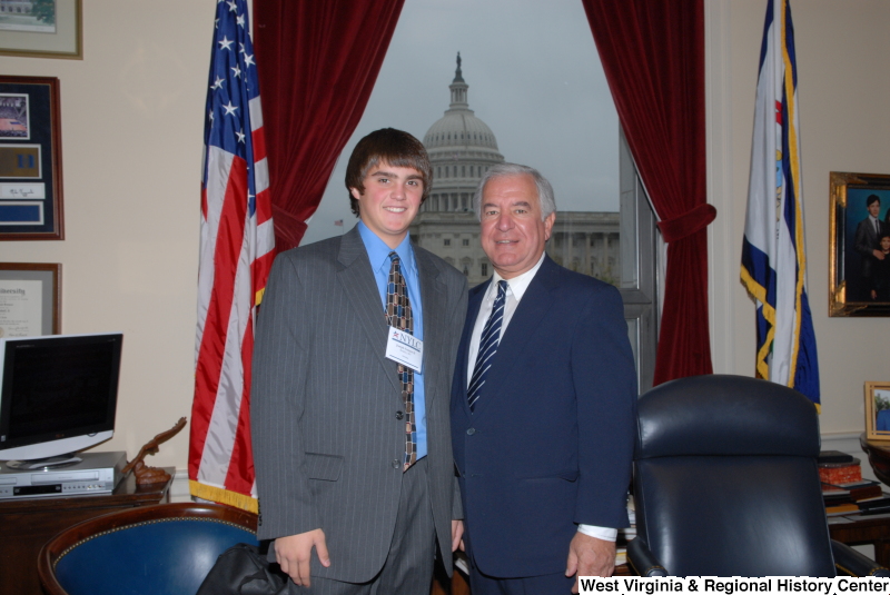 Congressman Rahall stands in his Washington office with a young man from Beckley, West Virginia, wearing a NYLC badge.