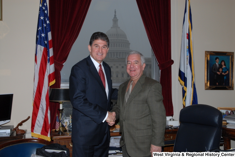 Congressman Rahall in his Washington office shakes hands with Joe Manchin III.