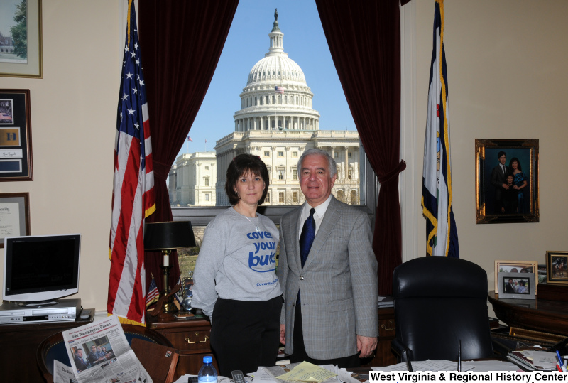 Congressman Rahall stands in his Washington office with a woman wearing a sweatshirt.