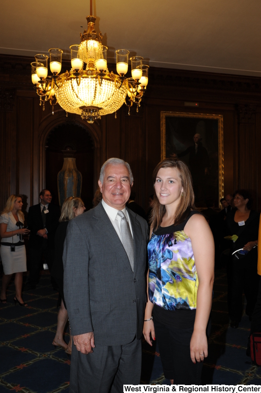 Congressman Rahall stands with a woman at a function.