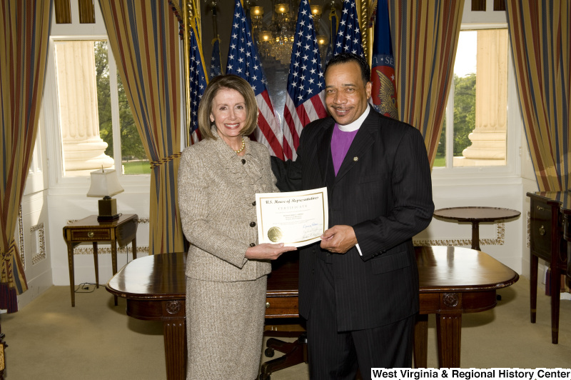 Nancy Pelosi presents a certificate to Bishop Fred T. Simms, Heart of God Ministries, Beckley, West Virginia.