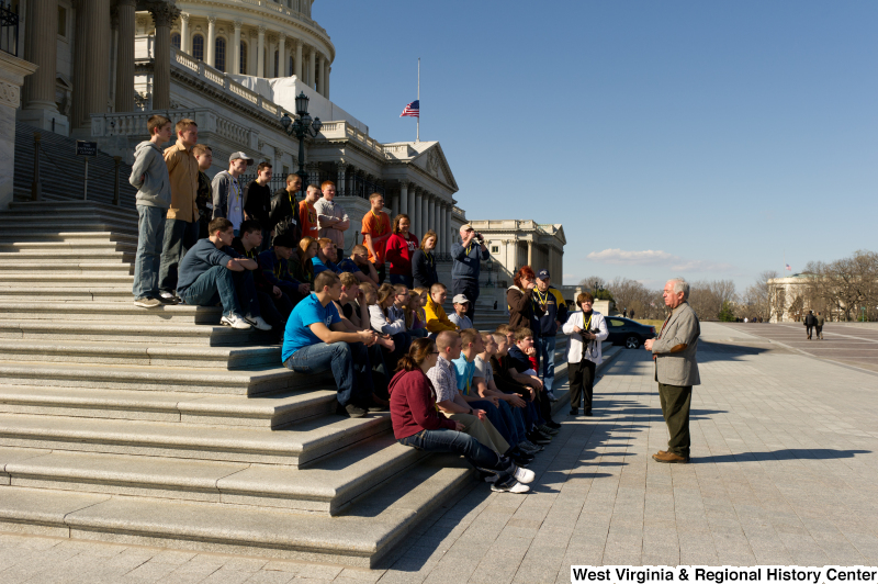 Congressman Rahall speaks to adults and teenagers on the steps of the Capitol Building.