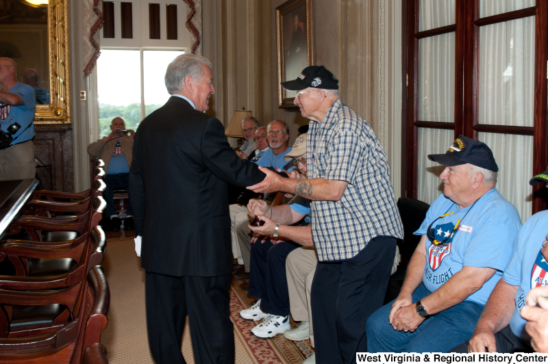 Congressman Rahall meets with men at a military award ceremony.