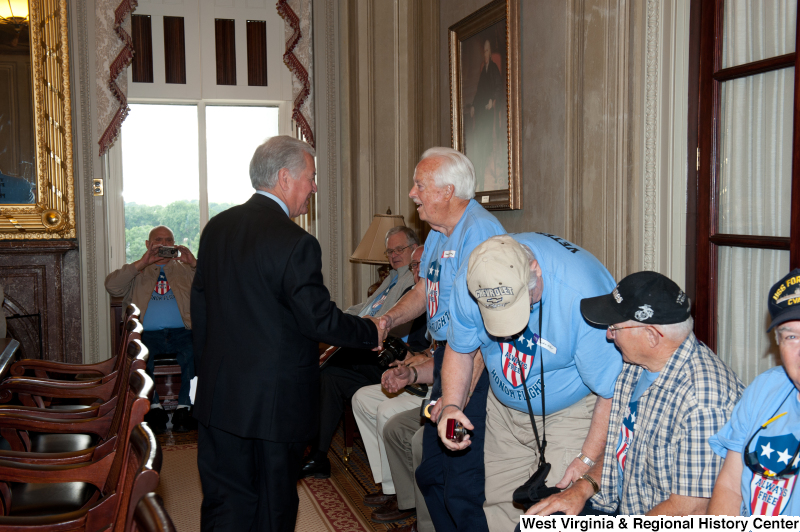 Congressman Rahall meets with men at a military award ceremony.