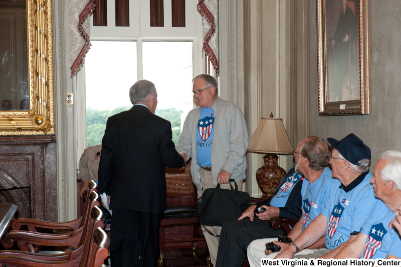 Congressman Rahall shakes hands with a man at a military award ceremony.