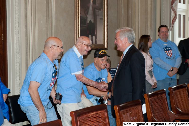 Congressman Rahall meets with other men at a military award ceremony.