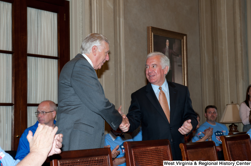 Congressman Rahall shakes hands with another man at a military award ceremony.