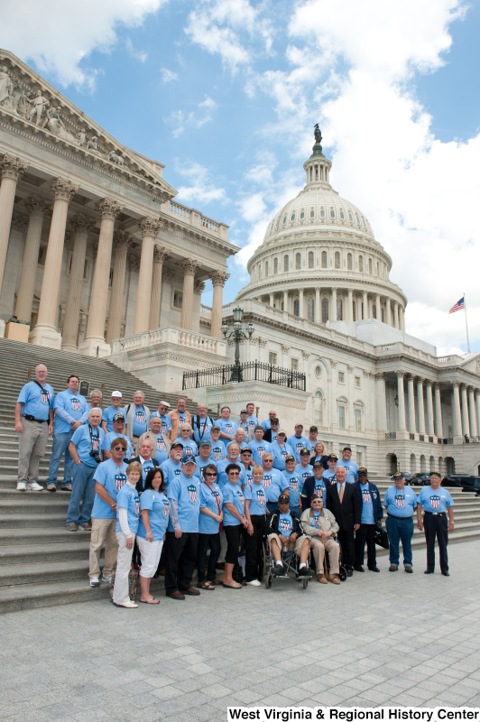 Congressman Rahall stands next to veterans on the steps of the Capitol Building.