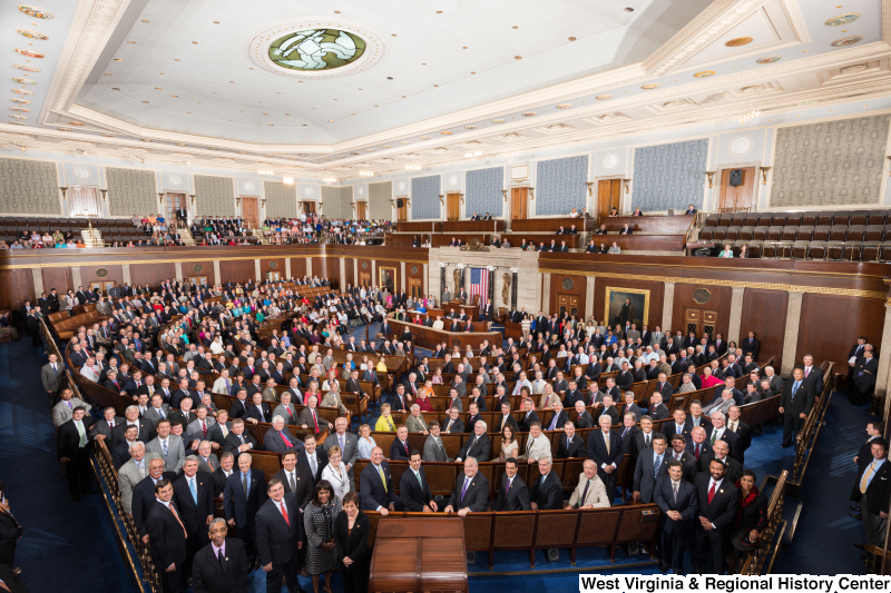 Members of the 113th Congress stand on the floor of the House of Representatives (official portrait photograph).