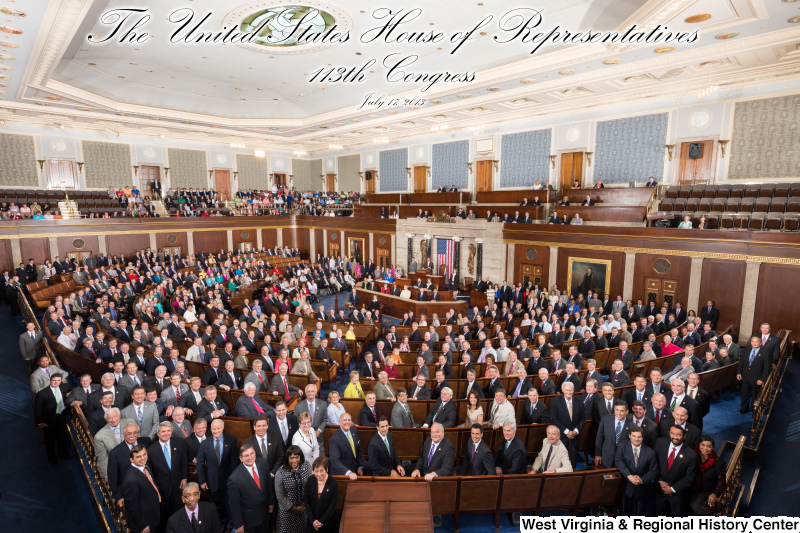 Members of the 113th Congress stand on the floor of the House of Representatives (official portrait photograph with title).