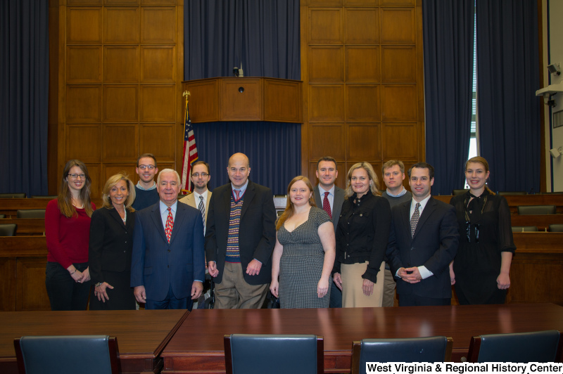 Congressman Rahall and a group of people stand at a conference table.