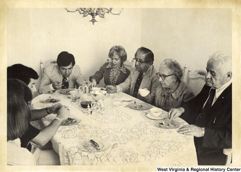 Congressman Nick Rahall II eating with his mother, father, maternal grandparents, and brother.
