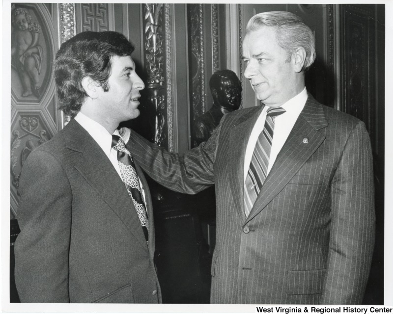 Congressman Nick Rahall II and Senator Robert C. Byrd talking. Bryd has his hand on Rahall's shoulder.