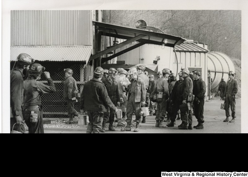 A large group of coal miners standing outside a building in Mingo county.