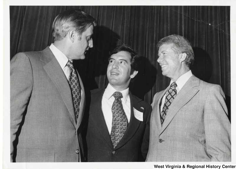 From left to right: an unidentified man, Congressman Nick Rahall II, and President Jimmy Carter.