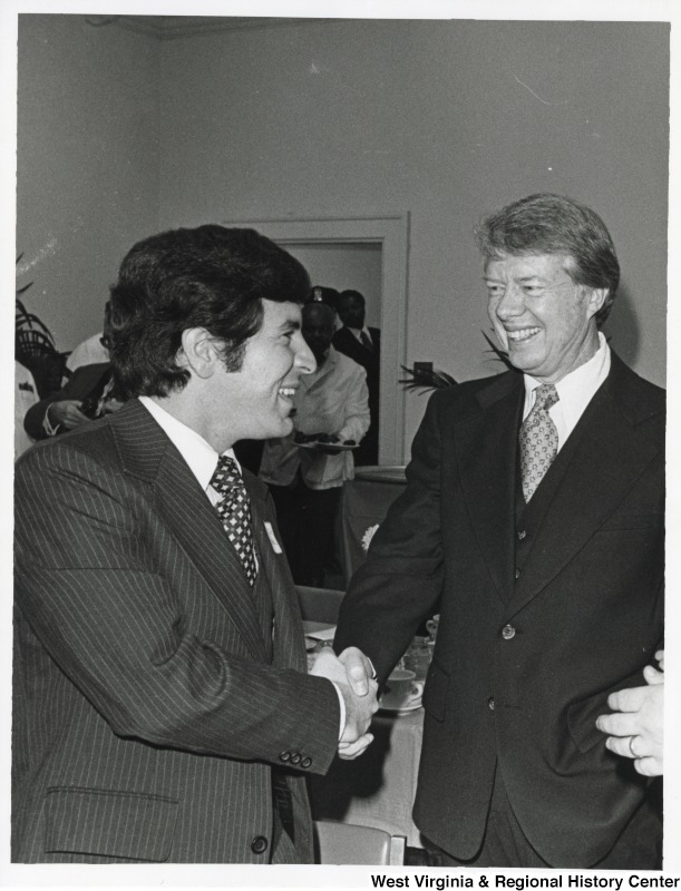 Congressman Nick Rahall II shaking the hand of President Jimmy Carter.