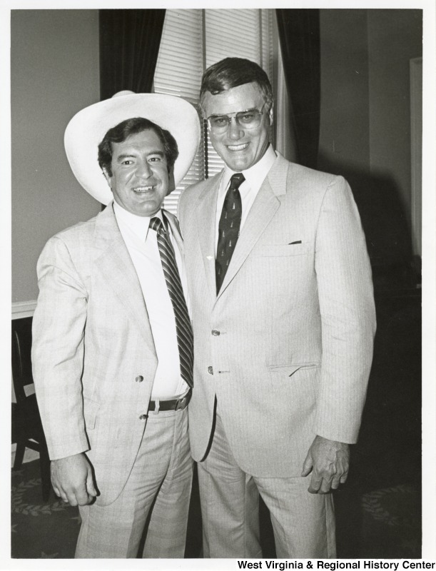 Congressman Nick Rahall II and Larry Hagman. Rahall is wearing a cowboy hat.