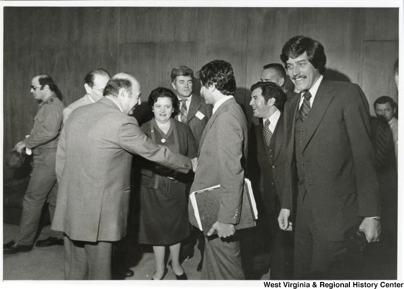 From right to left: Congressman Bob Carr, Congressman Nick Rahall, Congressman Toby Moffett, and Congresswoman Mary Rose Oakar. Congressman Nick Rahall II is shaking hands with an unidentified man.