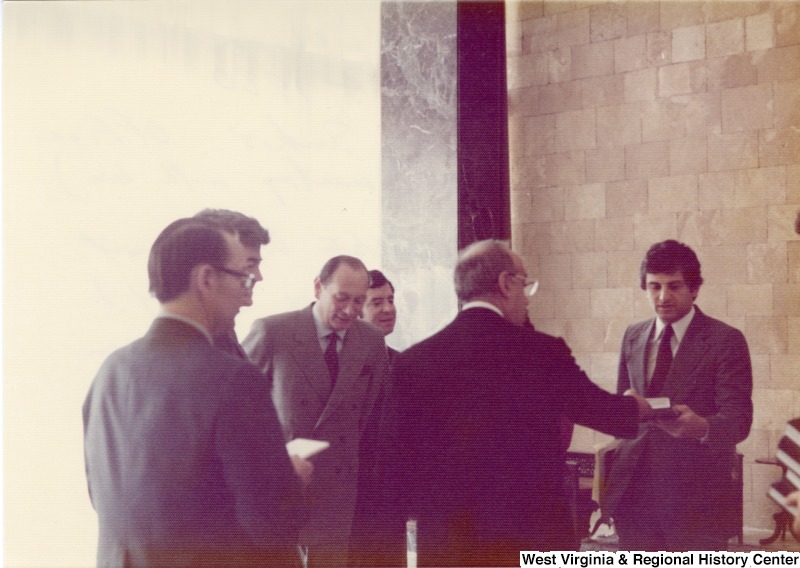 From left to right: Jim Collins, U.S. State Department Escort; Congressman Pete McCloskey (R-CA); U.S. Ambassador John Gunther Dean; Congressman Nick Rahall II (D-WV); a unidentified aide to President Sarkis: and Congressman Toby Moffett (D-CT).This photo was taken after their meeting with President Elias Sarkis. They are still in the presidents office in Yarze, Lebanon.