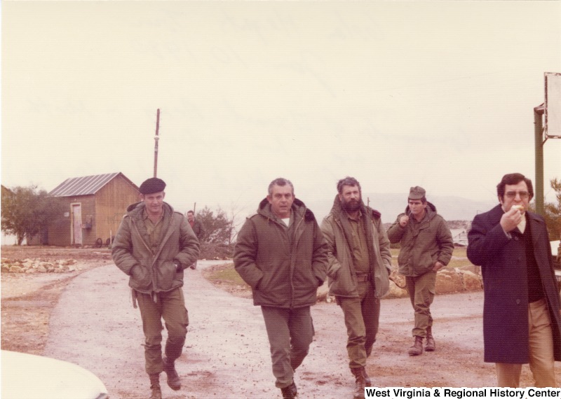 The Commander of the Israel Army in the North and his aides following Congressman Nick Rahall. They are on a tour of Golan Heights, Levant (Israel).
