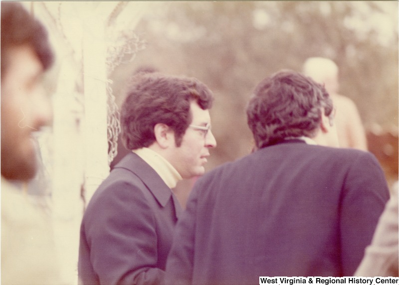 Congressman Nick Rahall and Congressman Toby Moffett at "Good Fence" on the border of Lebanon and Israel. They are talking to a resident of Kfeir, Lebanon who happened to know Rahall's Pappa Asaff's sister, Hanny Thabit, who lives there (assuming Kfeir).