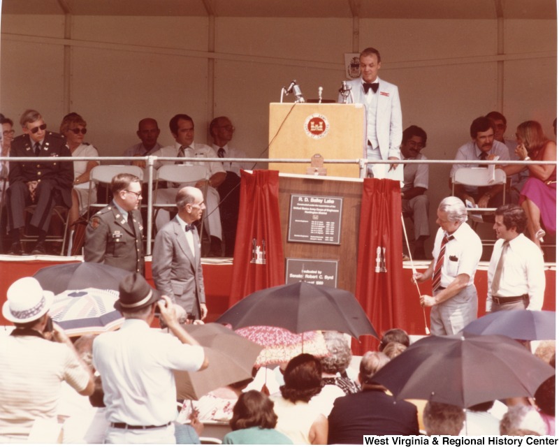 Senator Robert C. Byrd and Congressman Nick Rahall (first on the left) unveiling the plaques for the R. D. Bailey Lake dedication.  A second plaque reads "Dedicated by Senator Robert C. Byrd August? 1980."