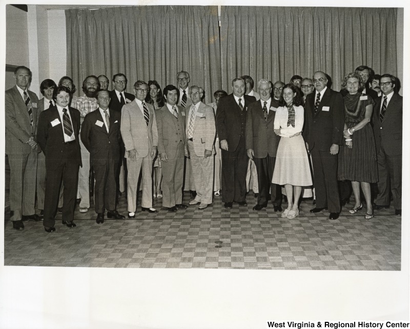 From right to left: Chuck Poland, Huntington, House of Delegates; Martha Whirly, Kanawha county, House of Delegates; Frank Martina, Executive Director, Mingo County Chamber of Commerce; four unidentified people; Congressman Nick Rahall II; Paige Wooldridge; Dave Riggs, Mingo County, later Rahall's District Director; and a unidentified barge operator.