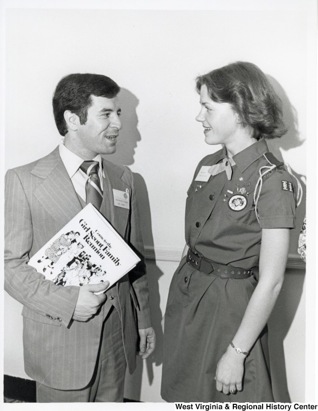 Congressman Nick Rahall II speaking with a unidentified Girl Scout at the Girl Scout Family Reunion.
