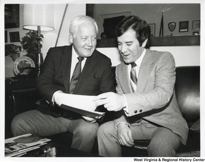 Congressman Nick Rahall going over documents with Carl Baggy, President of the National Coal Association.