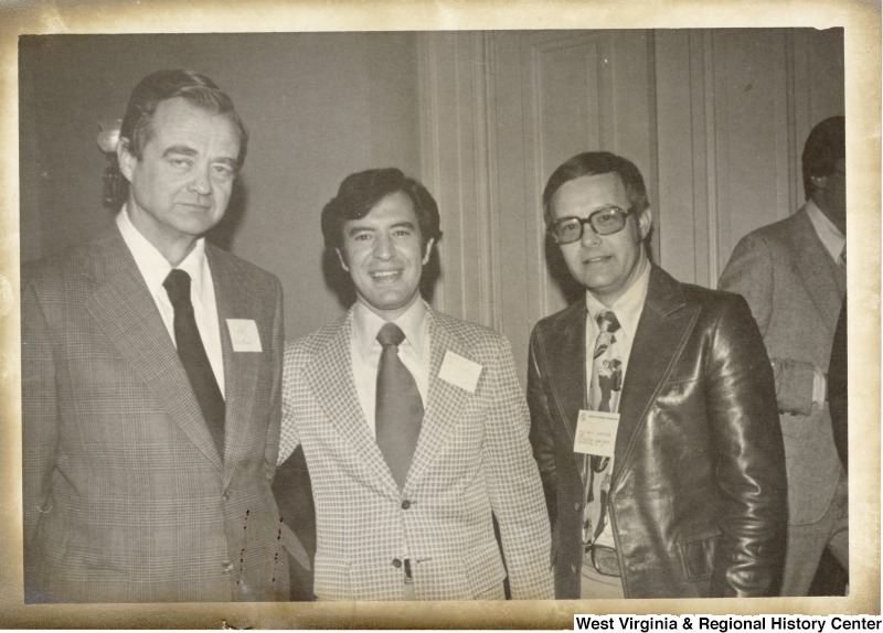 Congressman Nick Rahall II (center) with two unidentified men.