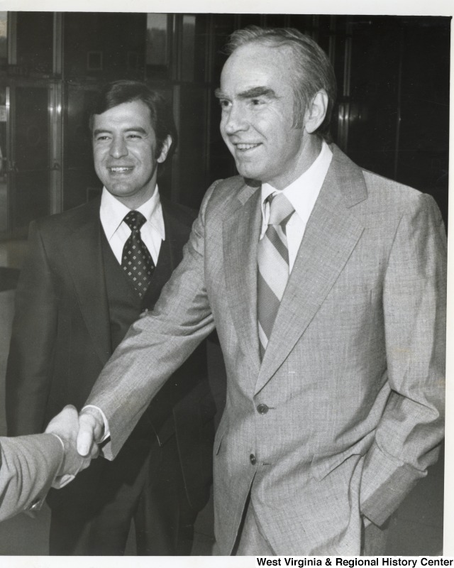 Congressman Nick Rahall II (left) with Majority Leader Congressman Jim Wright (D-TX) who is shaking someone's hand. Wright later became Speaker of the House.