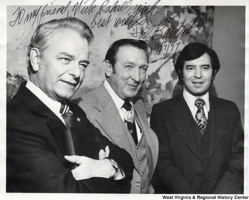 From left to right: Senator Robert C. Byrd; Hal Burdick, publisher of Huntington Herald-Dispatch; and Congressman Nick Rahall II. The photograph is signed 'To my friend, Nick Rahall - with best wishes.  Hal Burdick. 12/7/77'