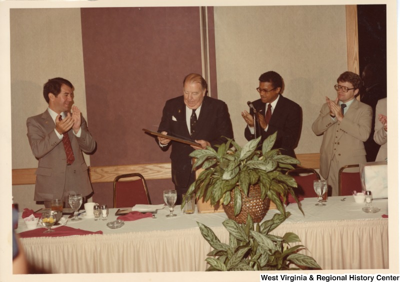 From left to right: Congressman Nick Rahall; Senator Jennings Randolph; Huntington City Mayor Joe Williams; Huntington Council Dallas Tracker; and Mrs. Robert C. Byrd (Erma) at the Holiday Inn in Huntington, W.Va. Senator Jennings Randolph is receiving an award.