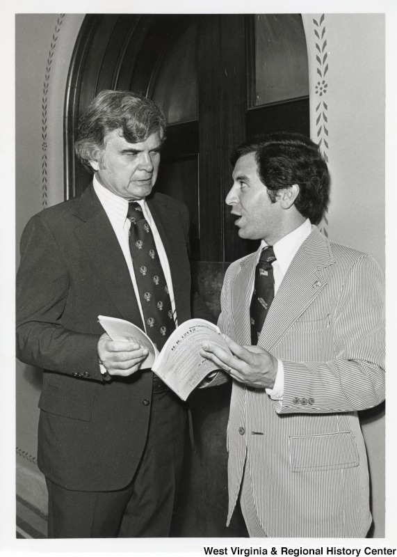 Congressman Nick Rahall II speaking to an unidentified man about the bill, H.R. 12112.