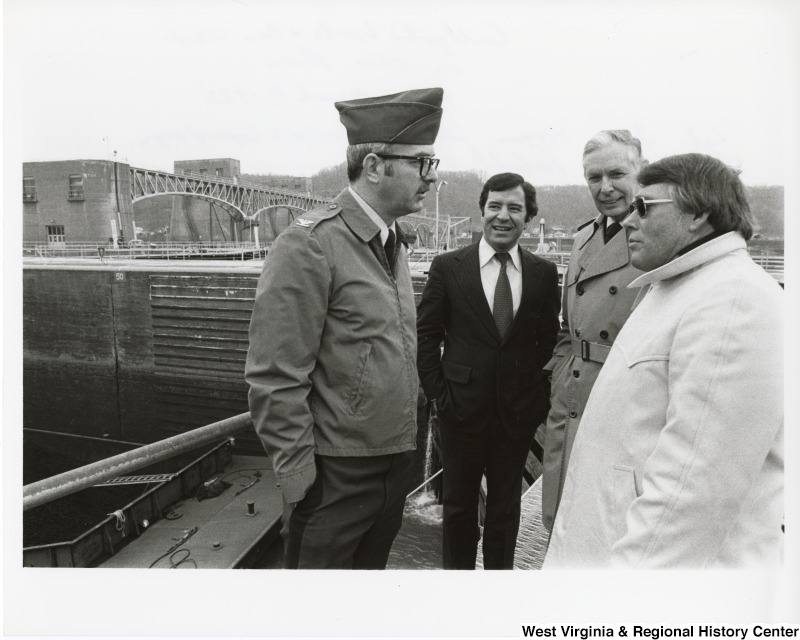 From left to right: Colonel James Higman, Huntington District U.S. Corps of Engineers; Congressman Nick Rahall II (D-WV); Congressman Tom Bevill (D-AL), Chair? subcommittee of appropriation energy and water; and A.V. Rush from Ashland Coal at the Gallipolis Locks & Dam visit on Ohio River. Now called the Robert C. Byrd Lock and Dam.