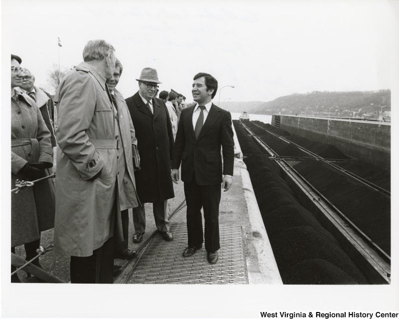 From left to right: Congressman Tom Bevill (D-AL); Congressman Cleve Benedict (R-WV); an unidentified man; and Congressman Nick Rahall II (D-WV) visiting the Gallipolis Locks & Dam on the Ohio River. It was later renamed Robert C. Byrd Locks & Dam.