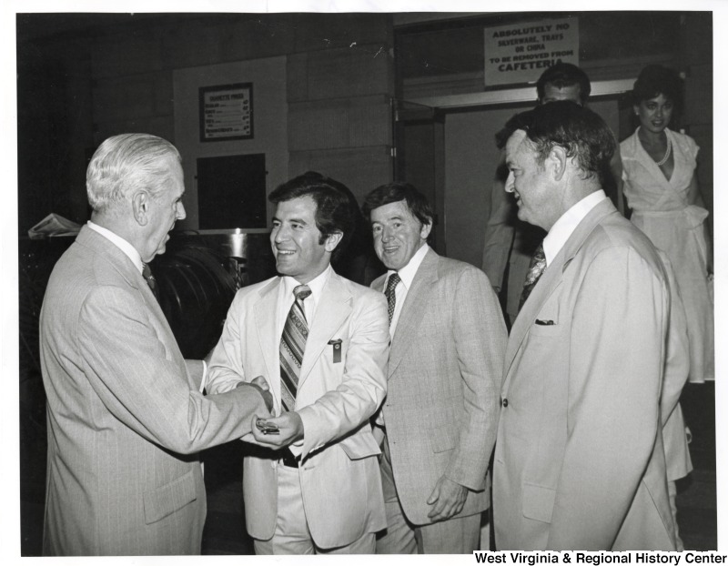 From left to right: Congressman Bill Natcher (D-KY); Congressman Nick Rahall (D-WV); Congressman Gene Atkinson (D to R -PA); Congressman John Myers (R-IN); and Congressman and Mrs. Dawson Mathis (D-GA) in the back. They are at the Home Gym Association Dinner.