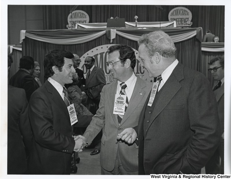 From left to right: Congressman Nick Rahall (D-WV), Congressman Donald Fraser (D-MN), Congressman Louis Stokes (D-OH) in the background; House Clerk Ted (Edmund) Henshaw; and Doorkeeper James Molloy (far right) at the Democratic Mid-Term Convention in Memphis, TN.