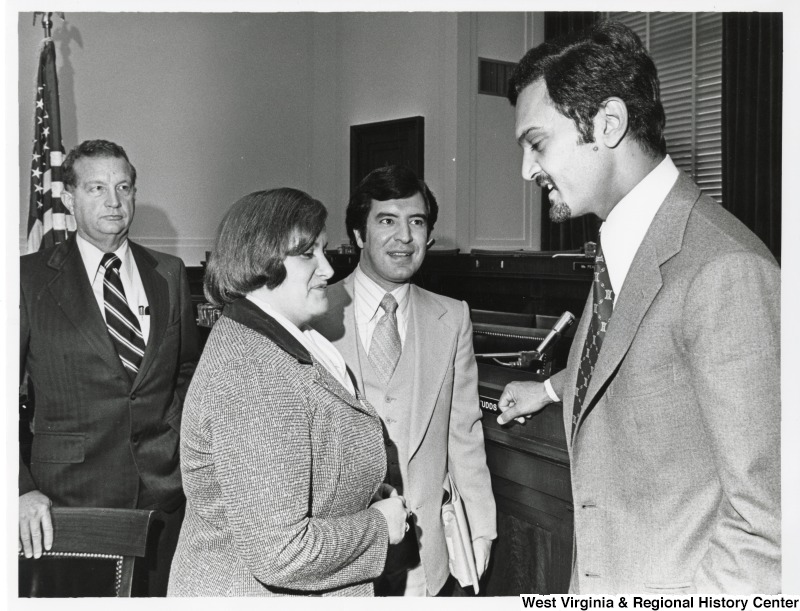 From left to right: an unidentified man; Congresswoman Mary Rose Oakar (D-OH); Congressman Nick Rahall (D-WV); and the Arab Ambassador in the Committee Room.