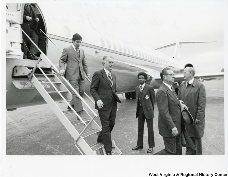 From left to right: Congressman Nick Rahall (D-WV), Congressman Bob Mollohan (D-WV), Congressman Jamie Whitten (D-MS) landing at Yeager Airport for the funeral of Congressman John Slack.