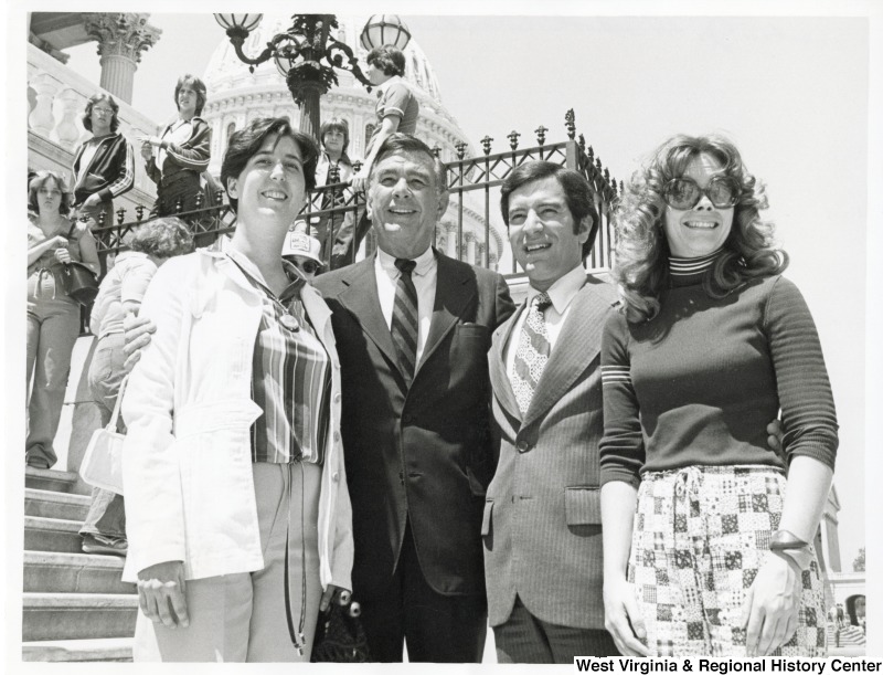 Congressman John Slack and Congressman Nick Rahall with two unidentified Lincoln Jr. High School teachers on the steps of the U.S. Capitol.
