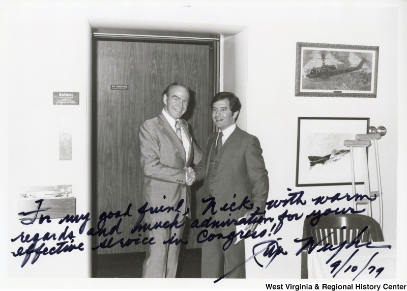 Congressman Nick Rahall II shaking the hand of Congressman Jim Wright (D-TX). The photograph is signed: "To my good friend, Nick, with warm regards, and much admiration for your effective service in Congress! - Jim Wright."